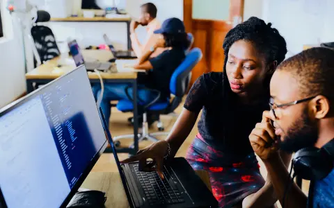 People working in front of a computer